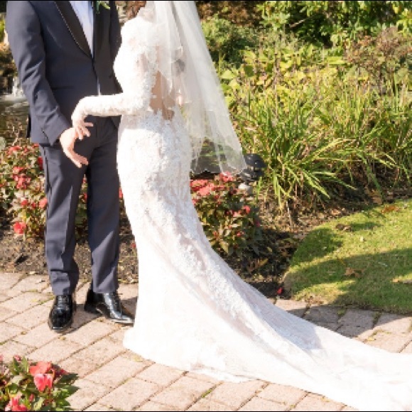 Petite long sleeve plunging v-neckline ivory lace wedding gown